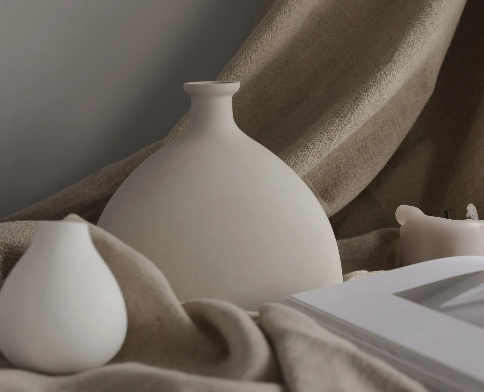 Artificial plants styled in a neutral ceramic vase